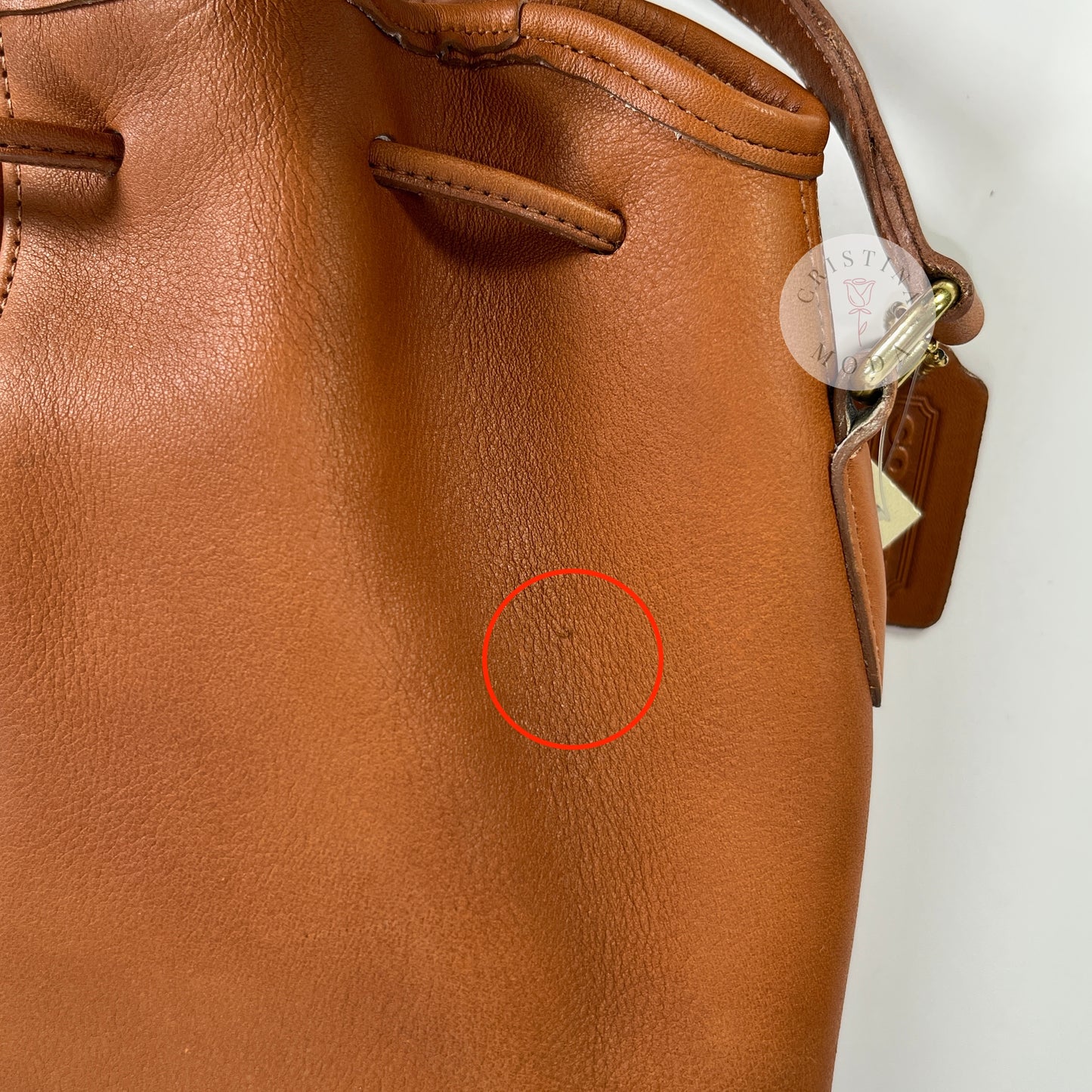 Close-up photo of a faint mark on the front of the bag. 