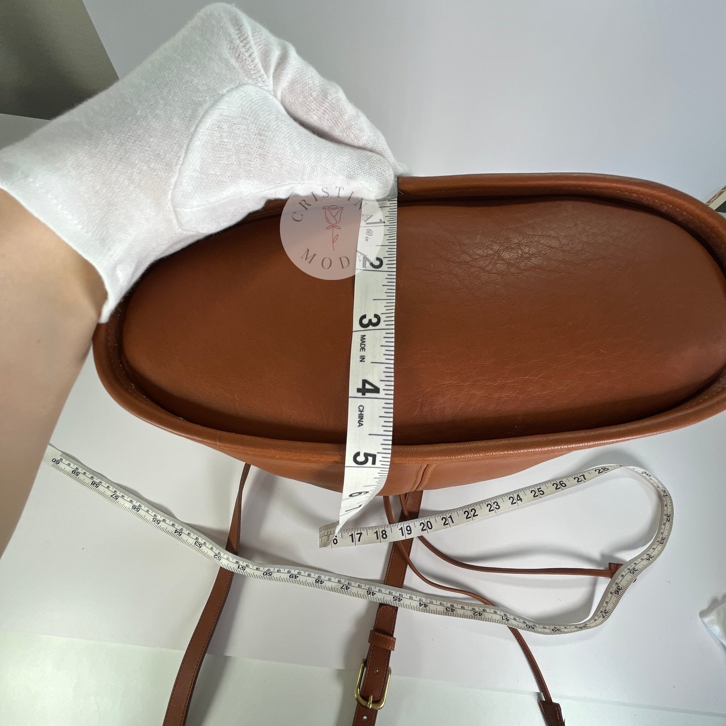 Photo showing measuring tape measuring the bottom of the bag. 