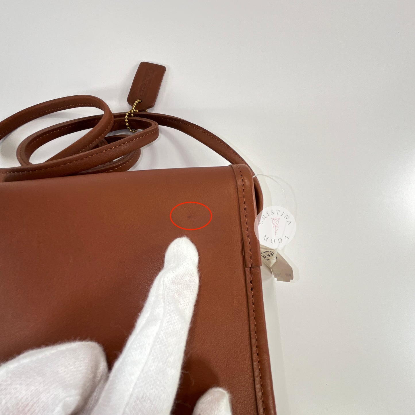 Vintage Coach Scooter Bag in British Tan, close up view of tiny mark on bag