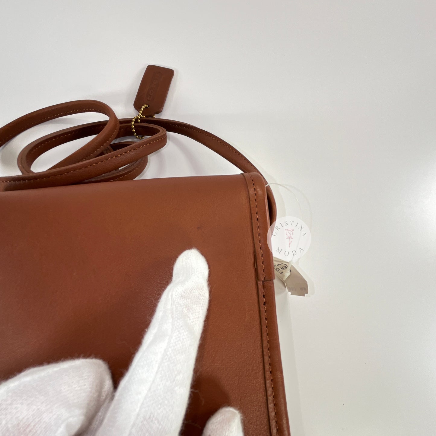 Vintage Coach Scooter Bag in British Tan, close up view of tiny mark on bag