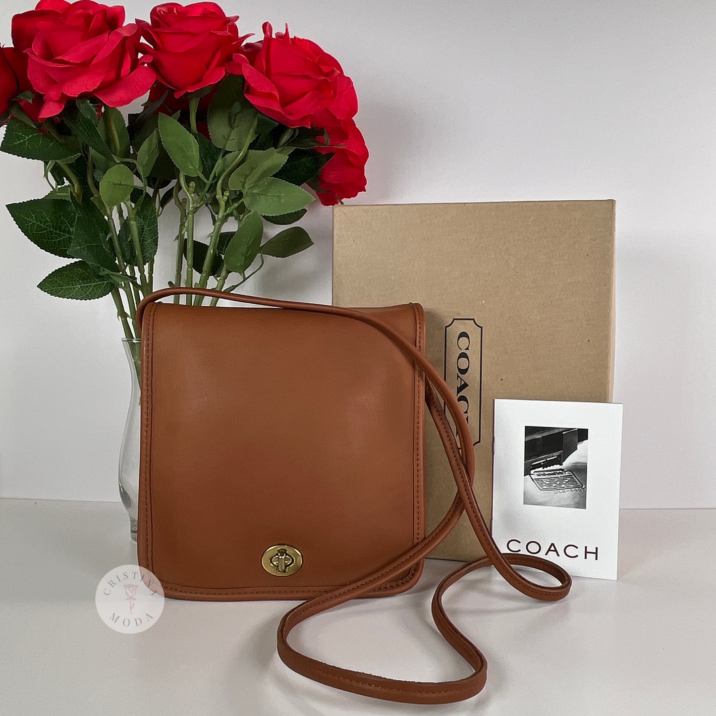 Front of vintage coach compact pouch