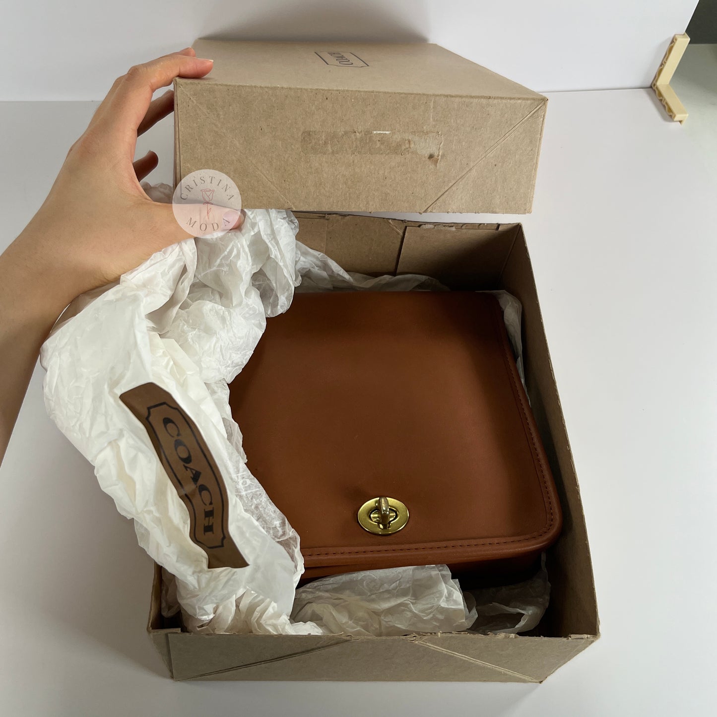 Photo showing bag inside of the Coach box it comes with