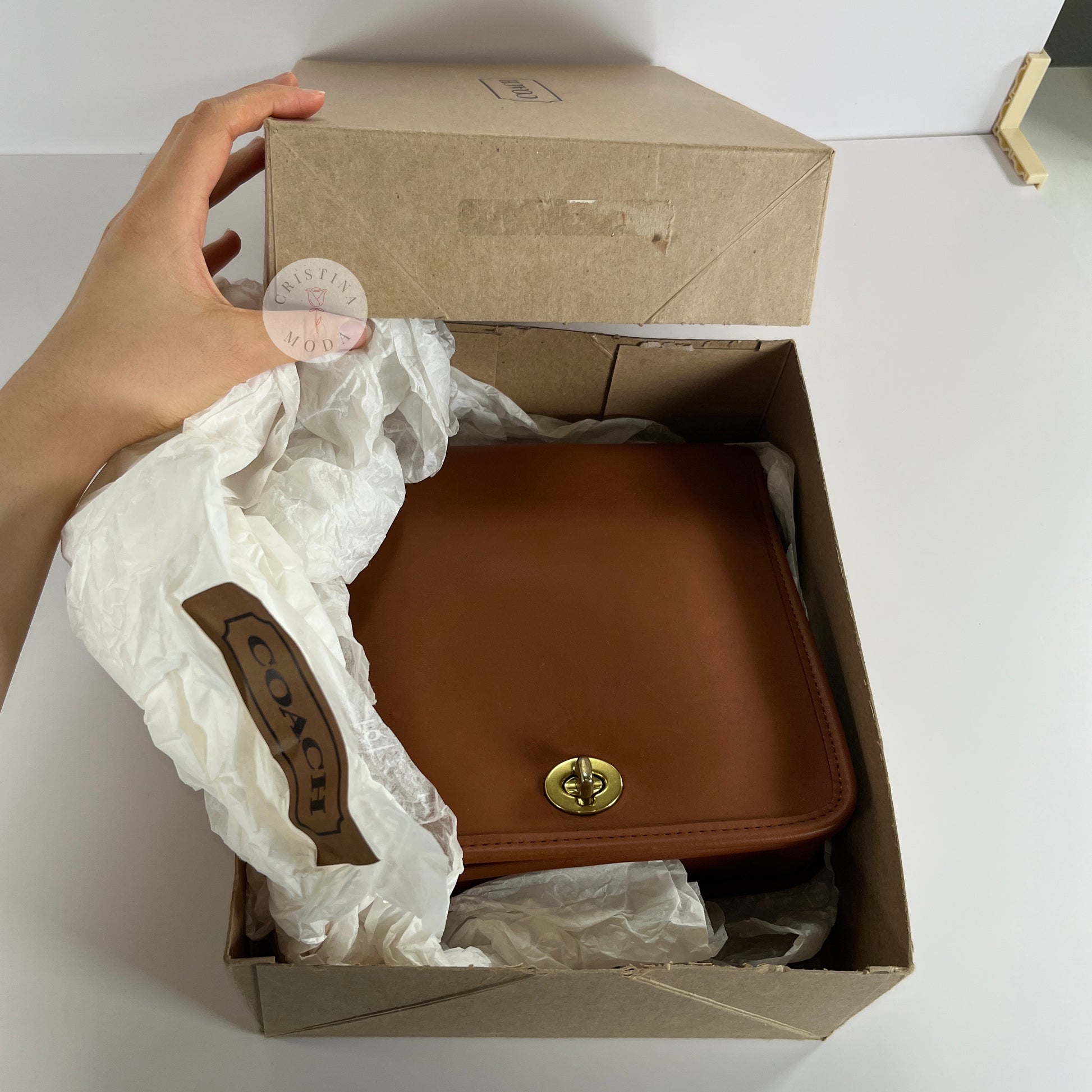 Photo showing bag inside of the Coach box it comes with