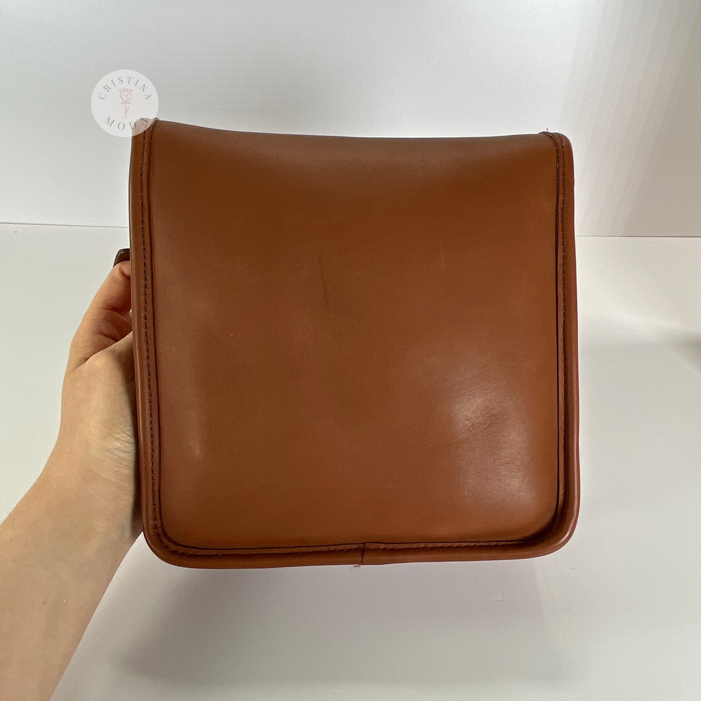 Back of vintage coach compact pouch