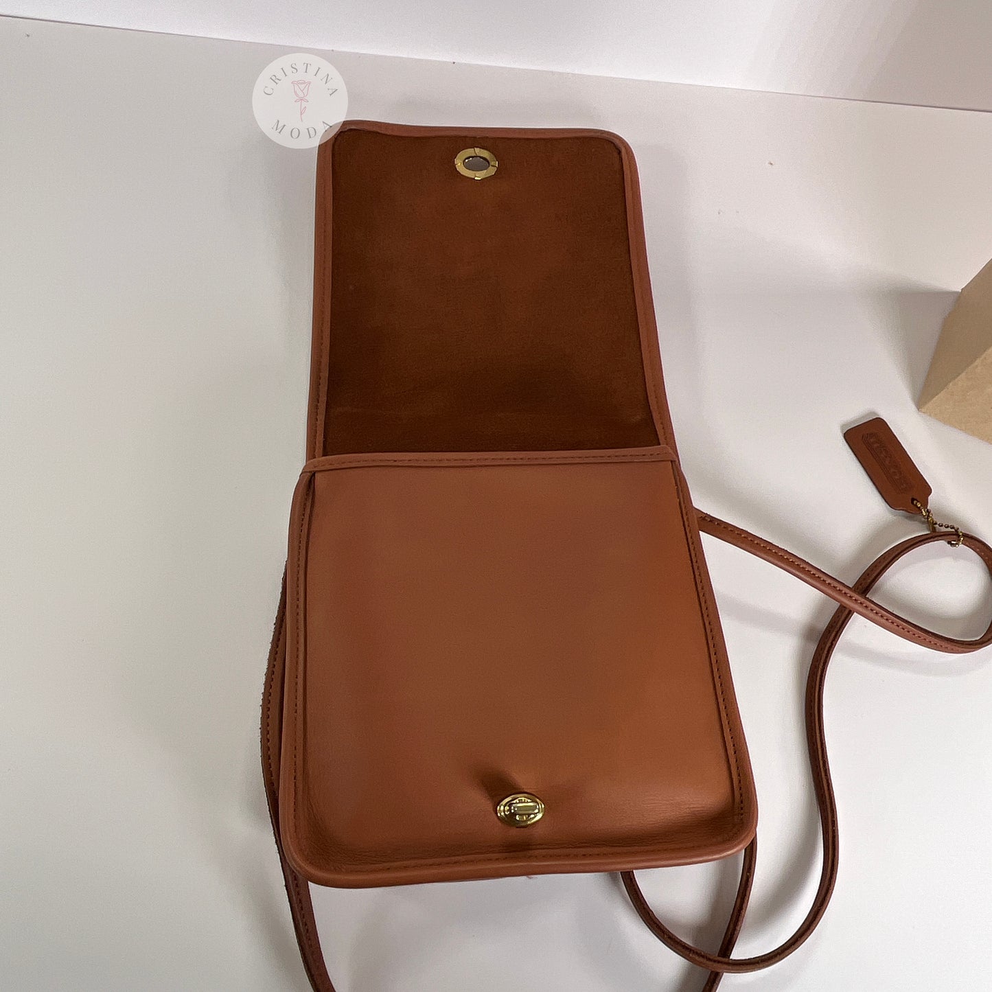 Area under front flap of vintage coach compact pouch
