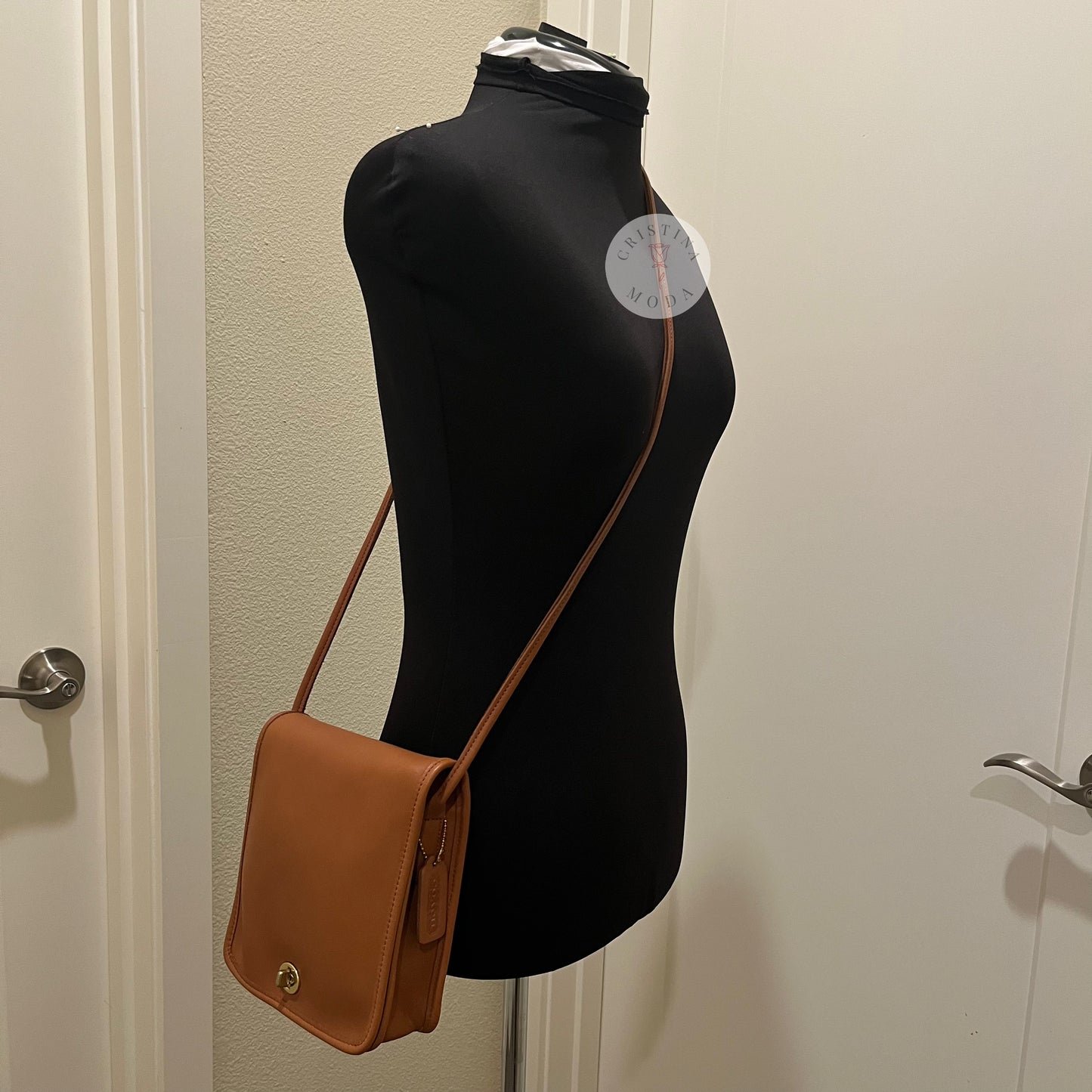vintage coach compact pouch on a mannequin