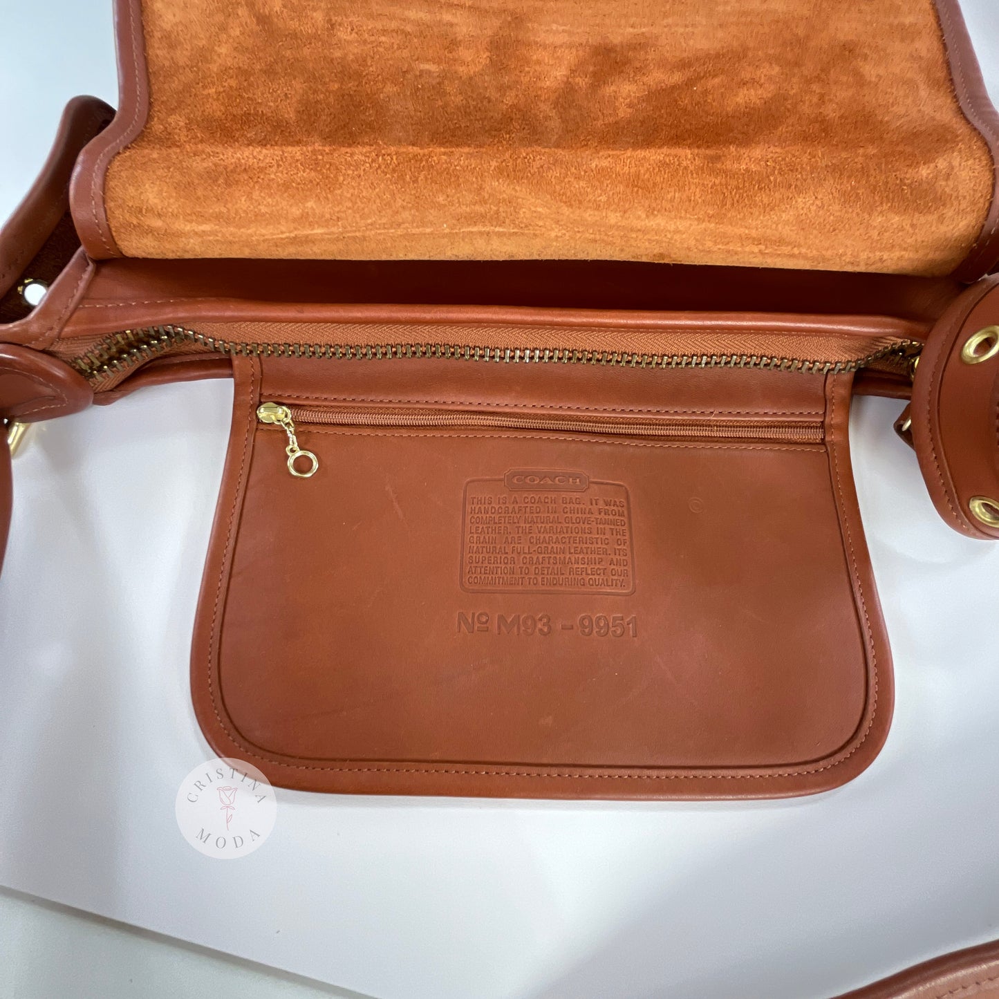Full view of internal hanging pocket where creed is stamped on vintage coach Patricia's Legacy Bag in British Tan
