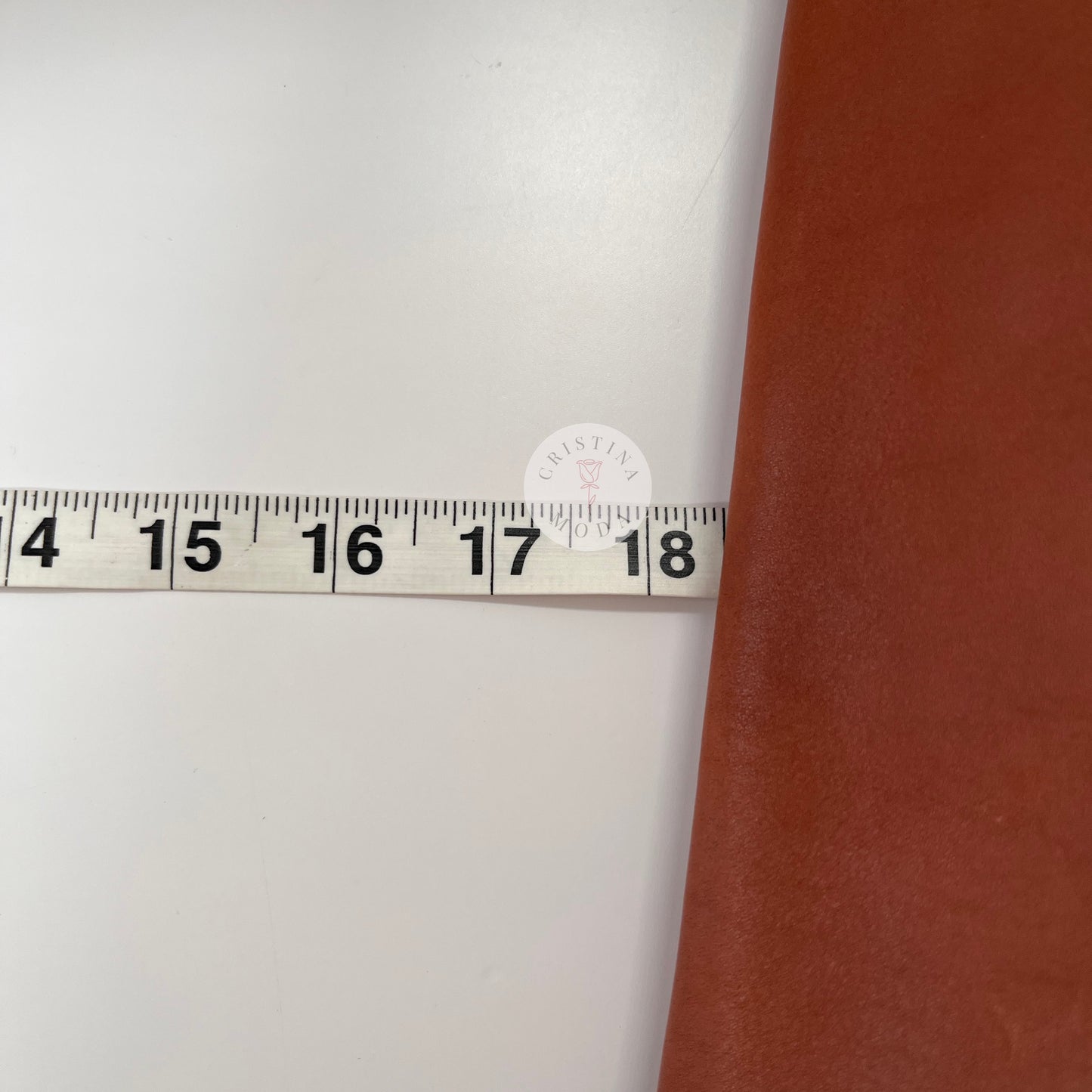 Close up view of measuring tape showing width measurement of vintage coach Patricia's Legacy Bag in British Tan