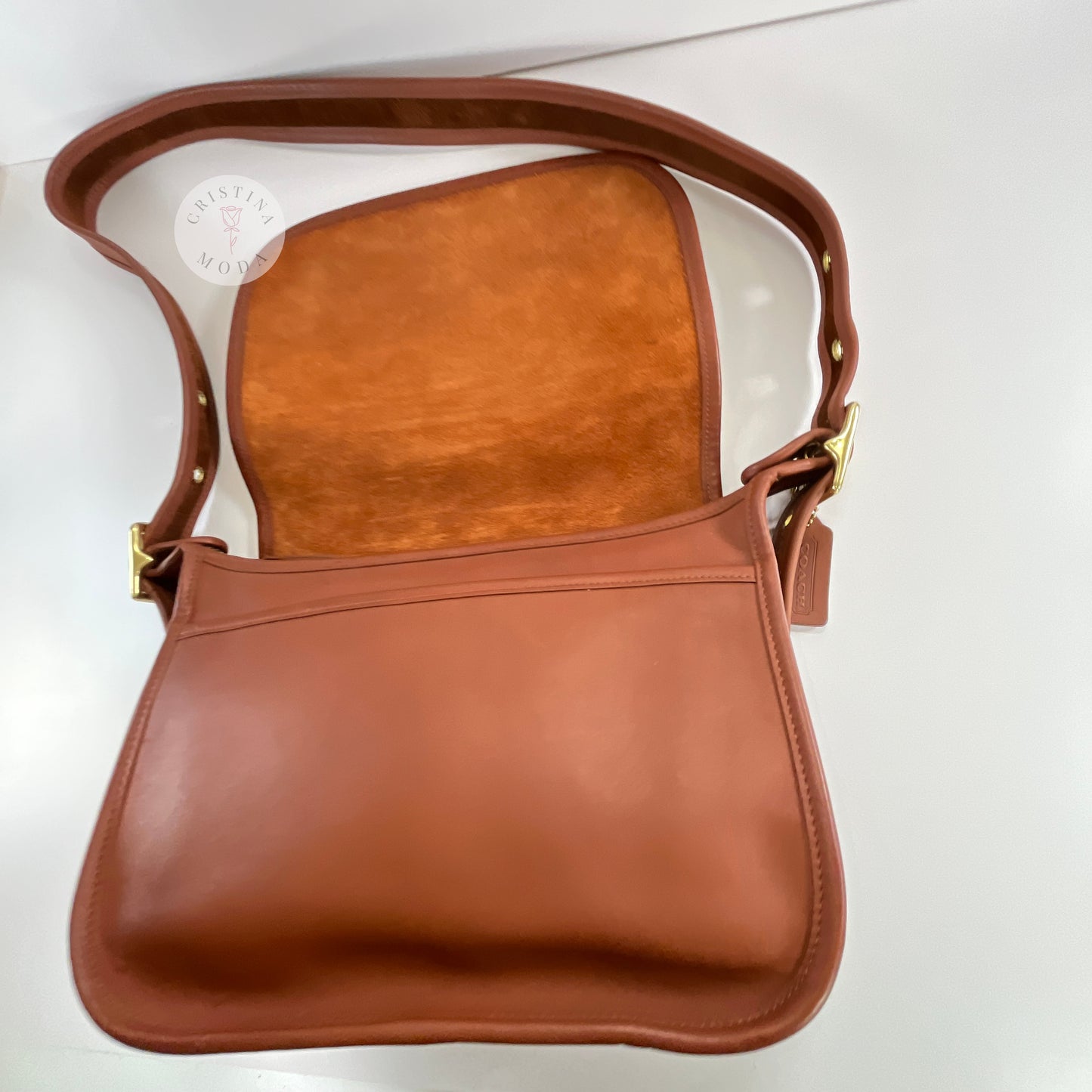View of area that sits beneath front flap of vintage coach Patricia's Legacy Bag in British Tan