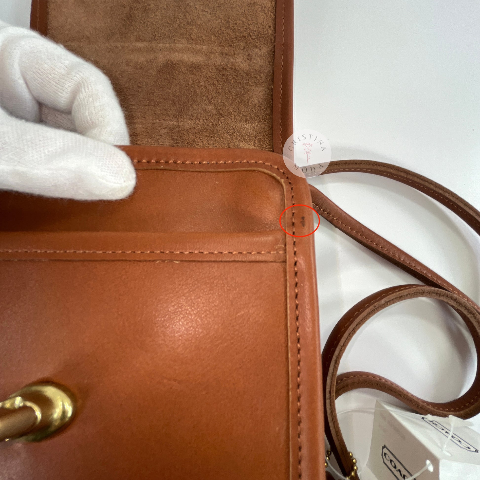 Close up view of small mark on side/edge area of British tan vintage Coach scooter bag