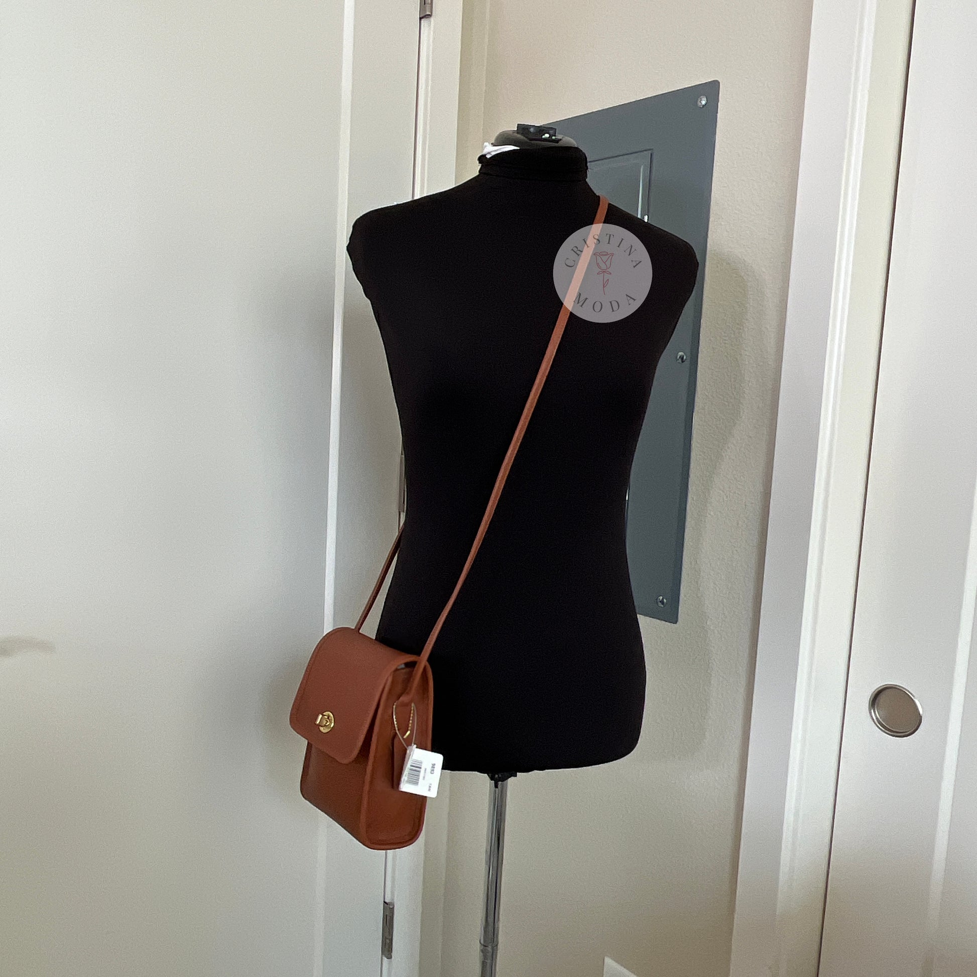 View of British tan vintage Coach Scooter Bag on a mannequin