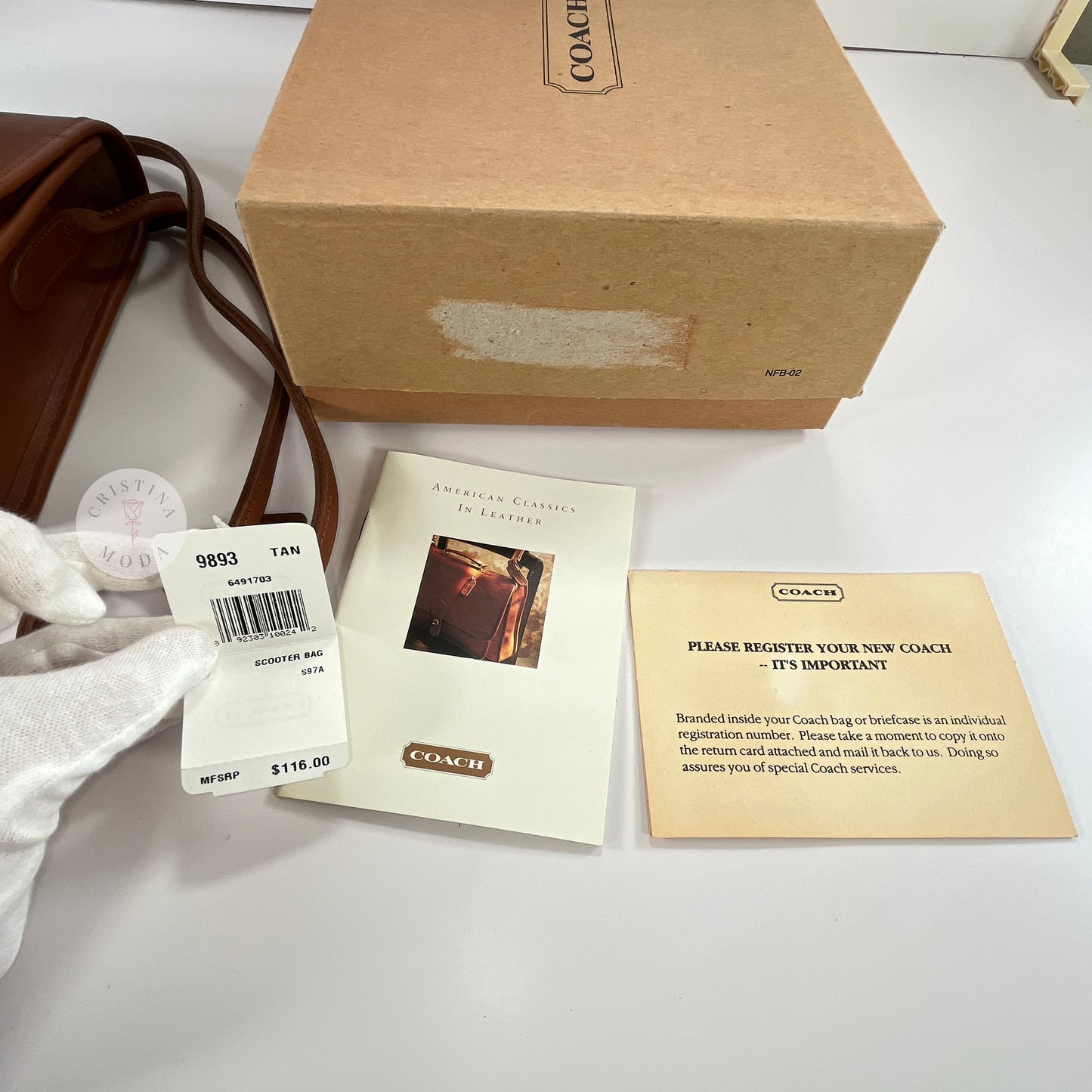 View of the box, price tag, booklet and registration card that come with the British Tan vintage Coach Scooter Bag