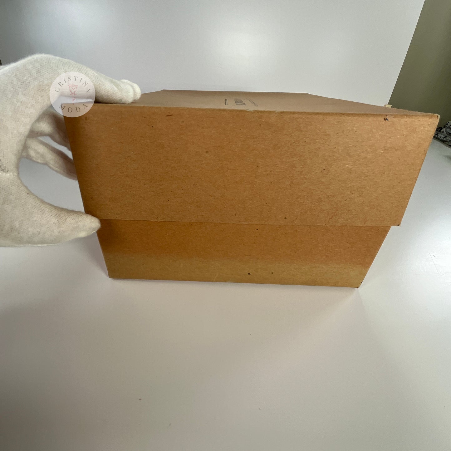 View of the side of the box that comes with British Tan vintage Coach Scooter Bag