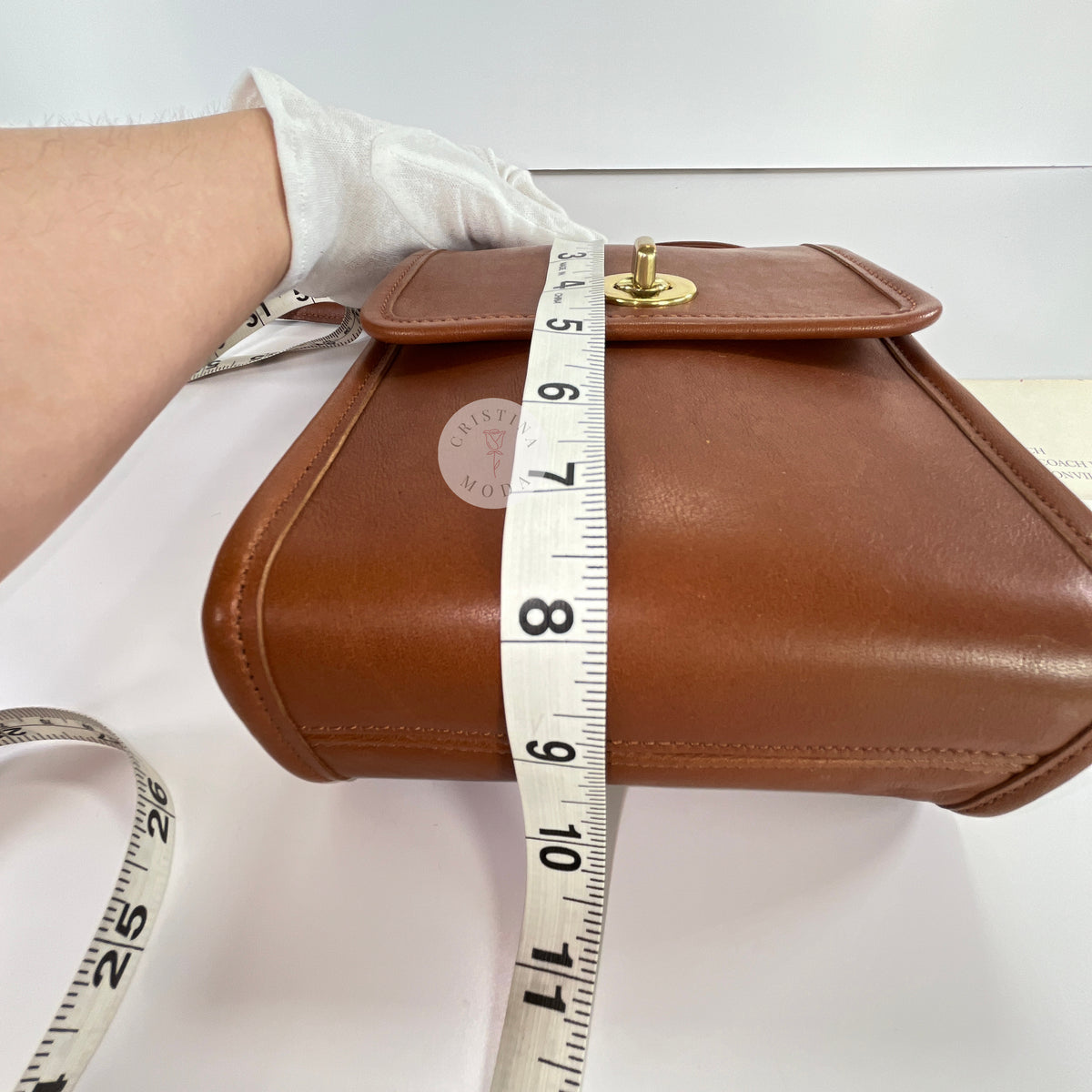 Vintage Coach Scooter bag in British Tan leather with measuring tape showing height measurement