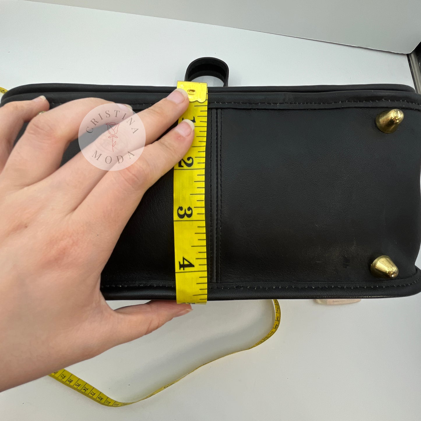 Photo with measuring tape that shows the bottom width of the bag