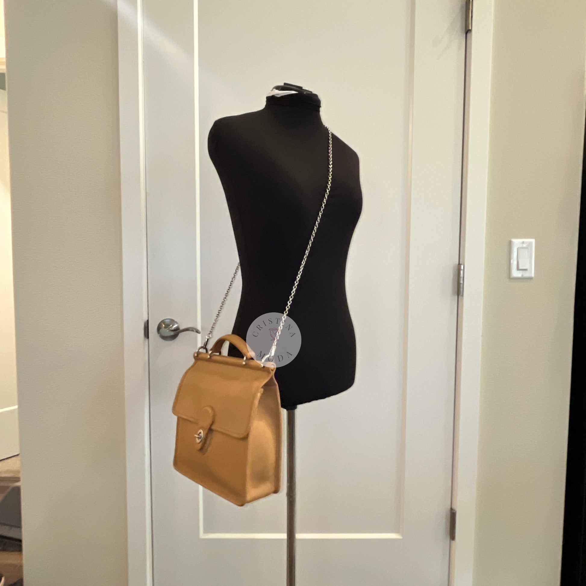 image of vintage coach willis bag worn crossbody on a mannequin