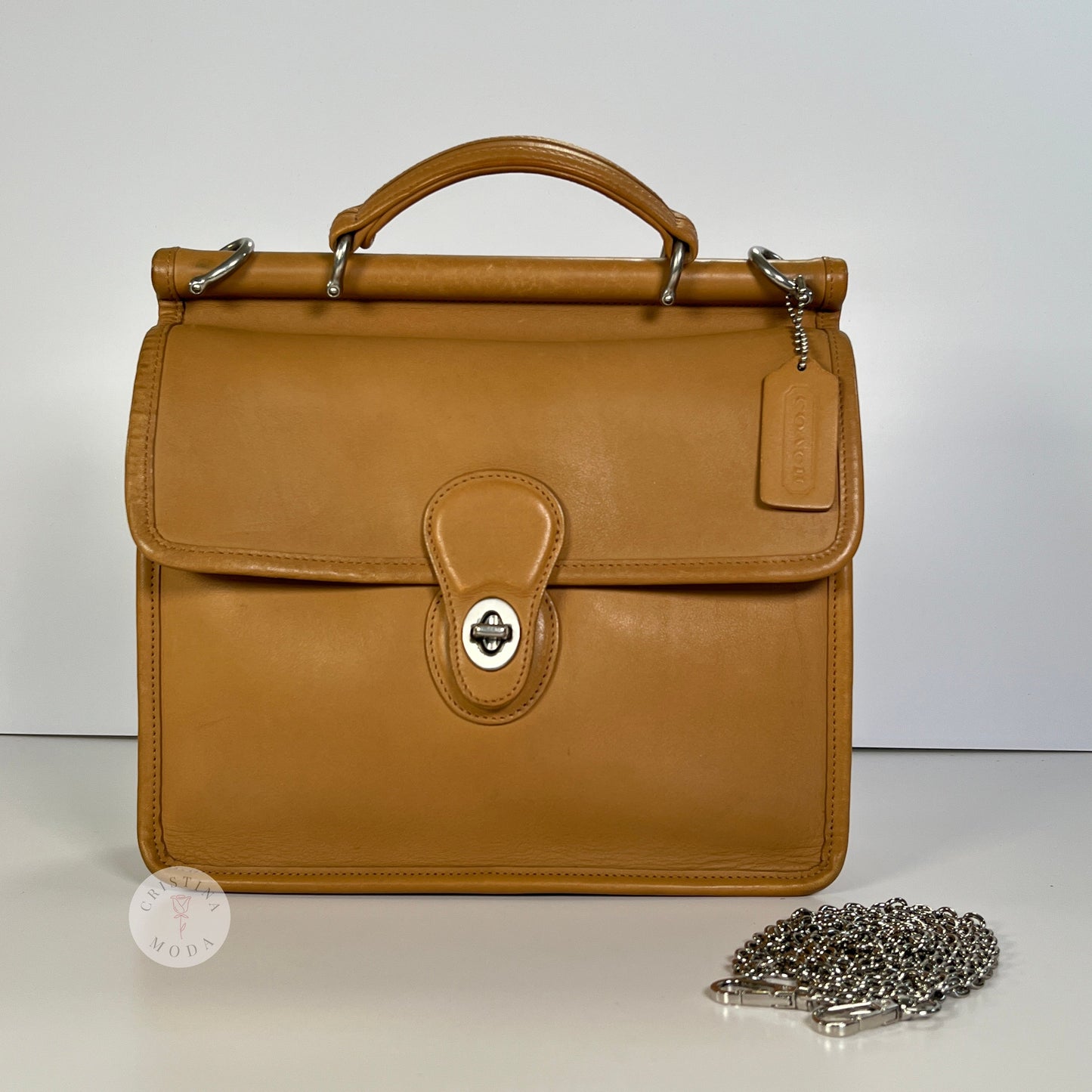image showing front of vintage Coach Willis Bag with metal replacement strap