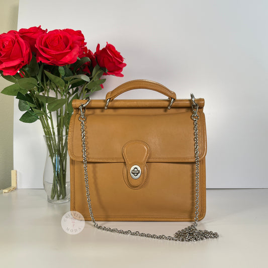front of vintage Coach Willis Bag with metal replacement strap