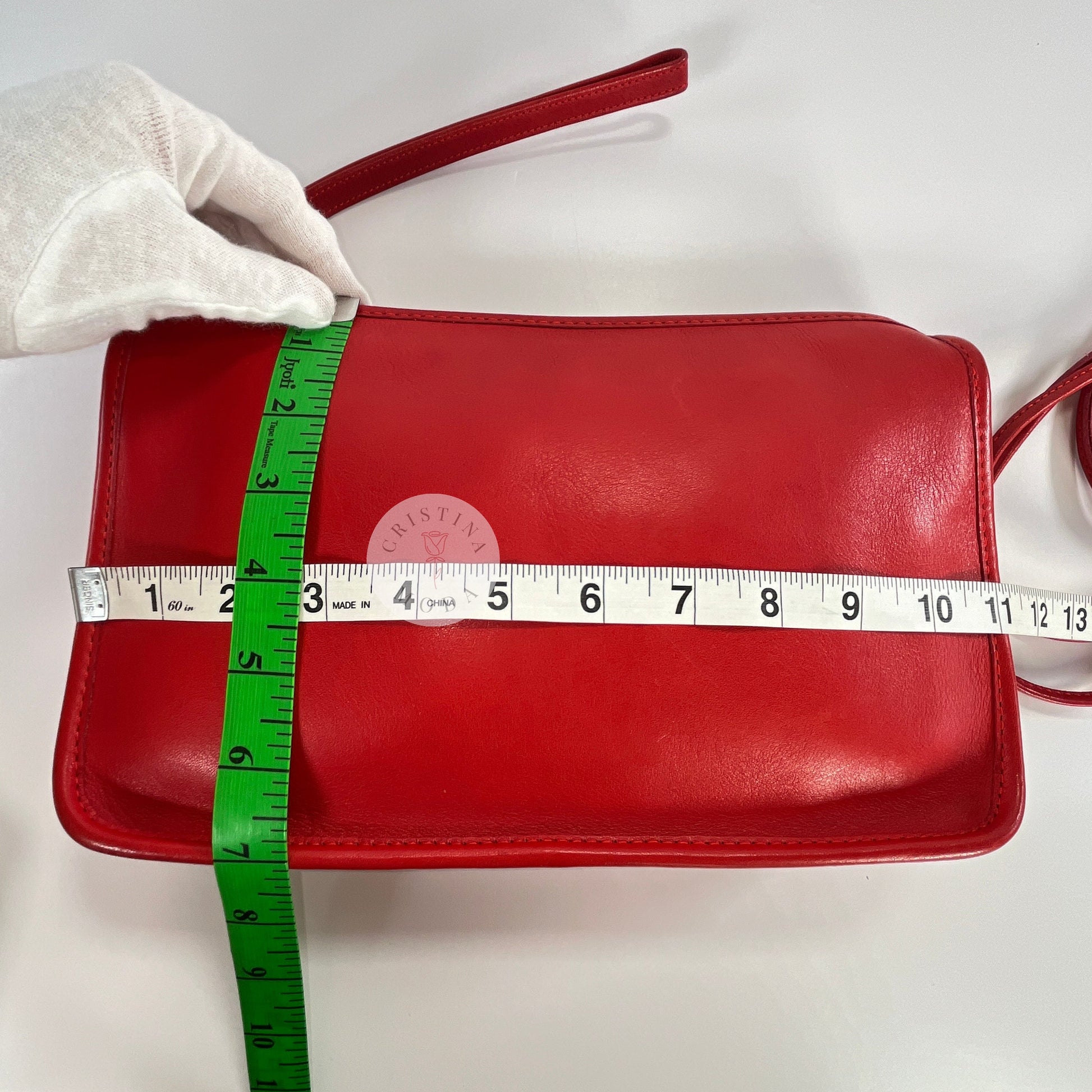 Vintage Coach Zippered Clutch in Red, view of bag with measuring tape showing width and height of bag