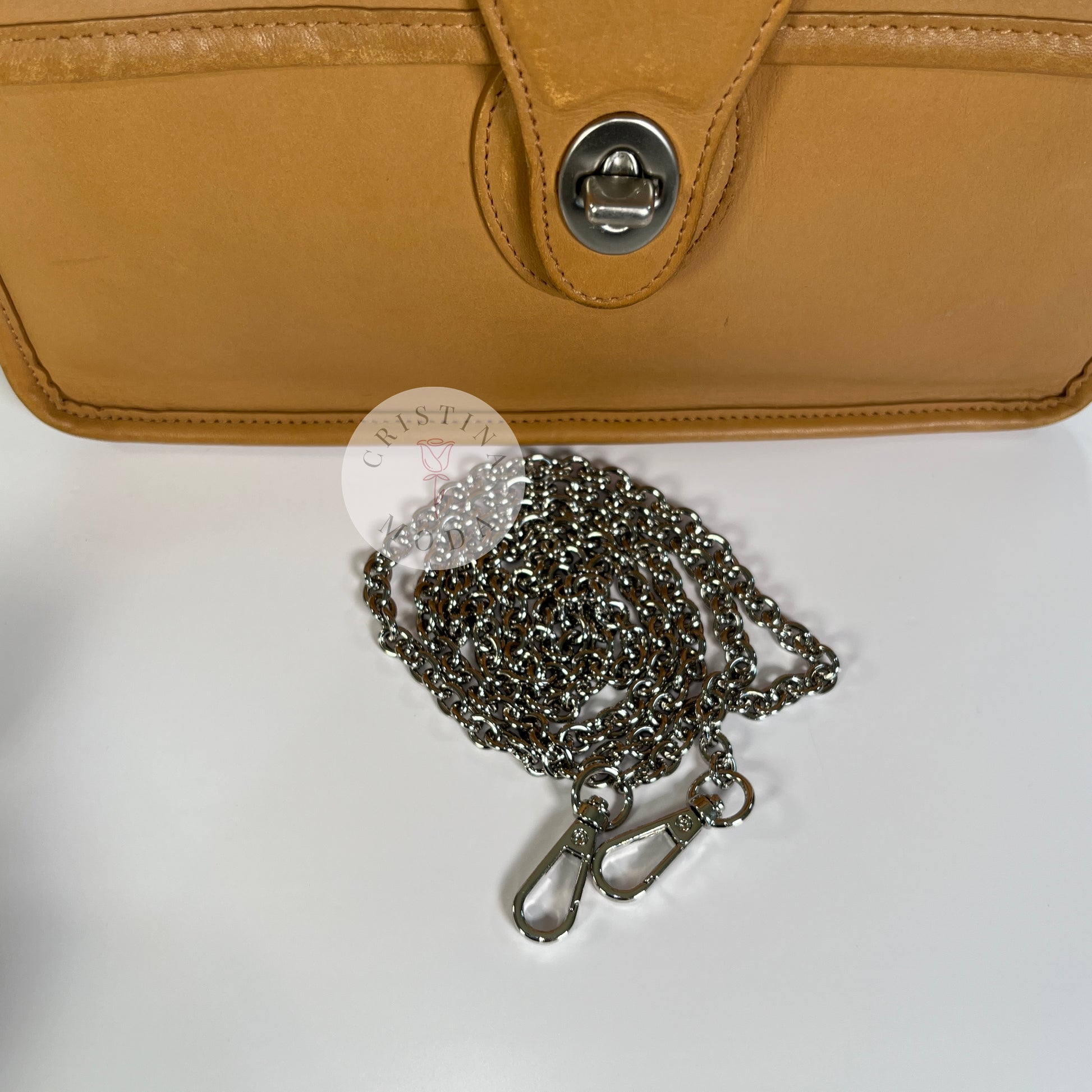 image of metal replacement strap that comes with bag